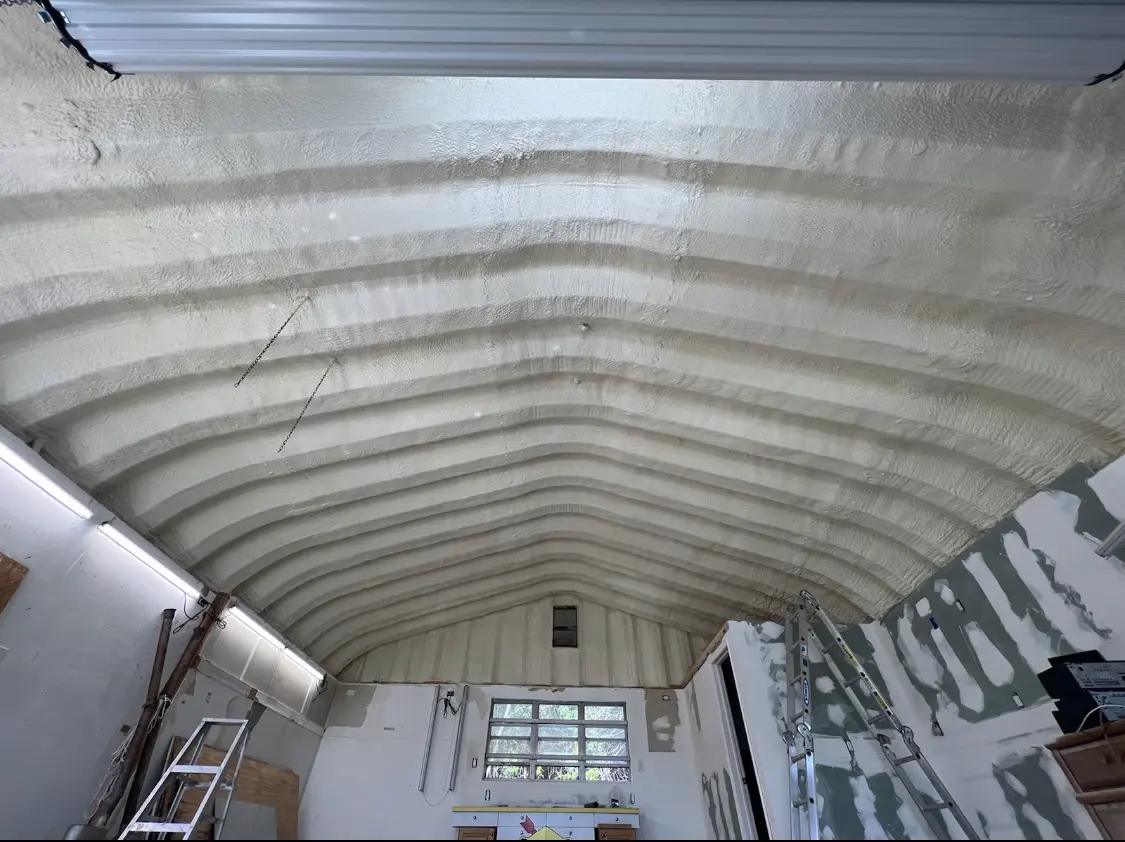 Spray polyurethane foam applied to the underside of a metal roof deck in Tuckahoe